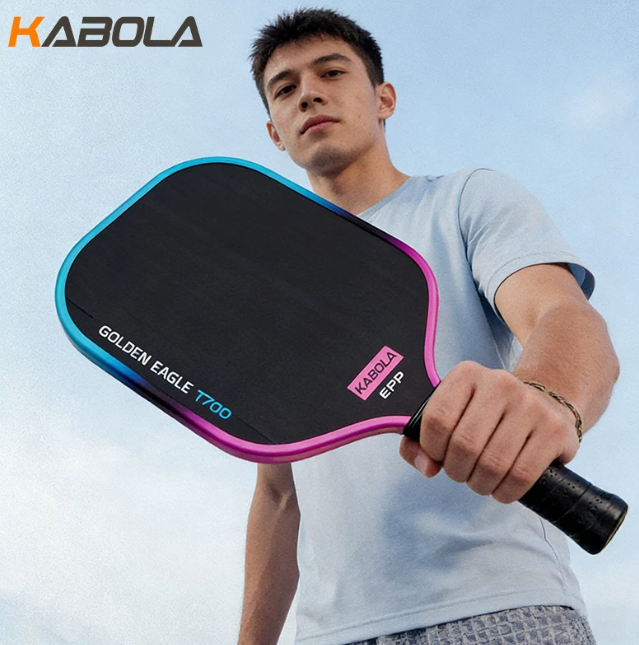 KABOLA athlete holding a GOLDEN EAGLE pickleball paddle